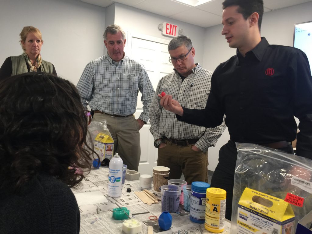 Touimi showing instructors the 3D printed piece which will be replicated. Incidentally, Instructors Hayes and Callahan were buddies who hadn’t seen each other in 20 years! Glad AET Labs can do our part in reuniting like-minded educators! ;) 