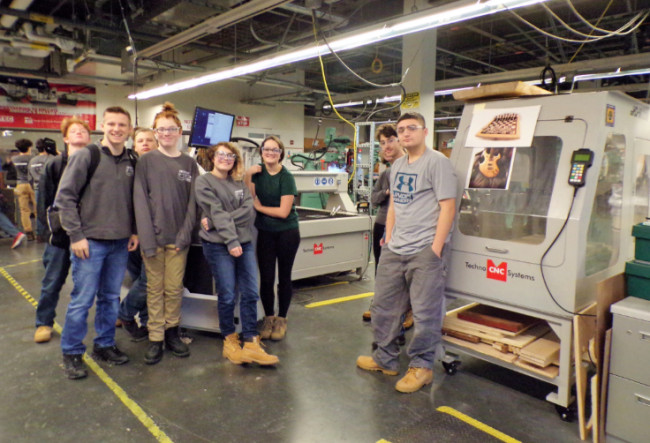 Students with CNC plasma cutters in the advanced manufacturing lab at Essex North Shore.