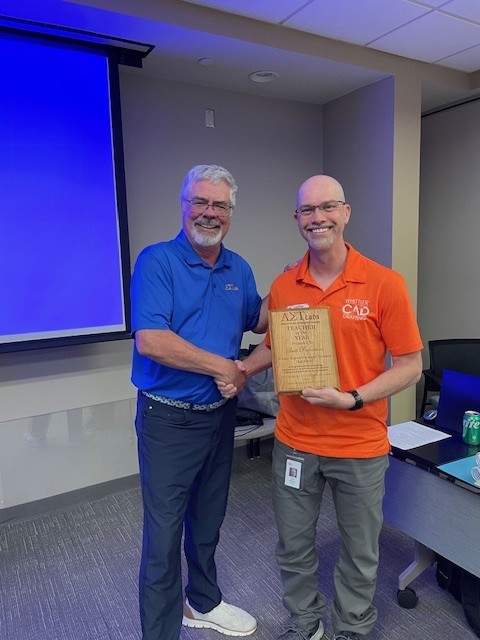 Mark handing Scott the AET Labs CAD Teacher of the Year award.
