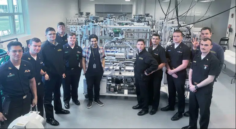 cadets and professor at a lab at an instrumentation and operations control lab at Mass Maritime Academy