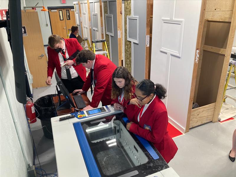 Students using an Epilog Laser at the Skills USA MA 2022 Competition