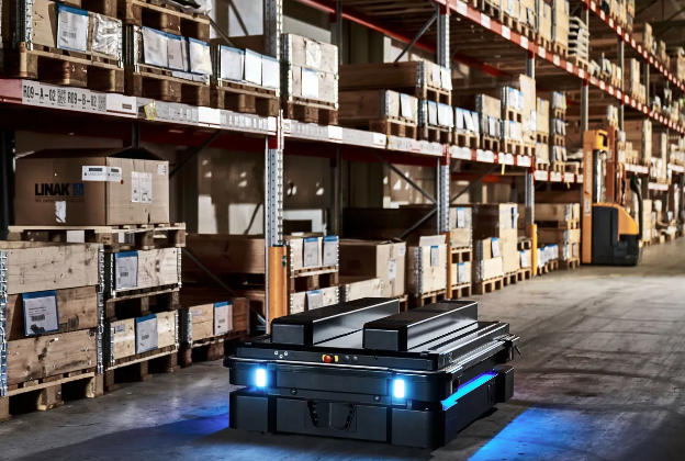 Mobile industrial robot moving autonomously in a warehouse.